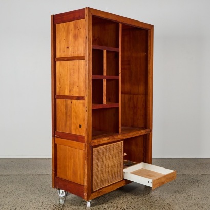 A Large Wooden Storage Unit On Castors