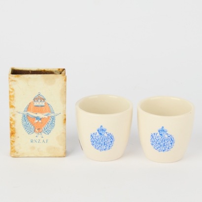 A RNZAF Matchbox-holder and Crown Lynn Egg Cups