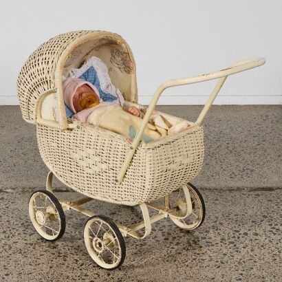 A Vintage Dolls Pram with Limited Edition New Born Doll