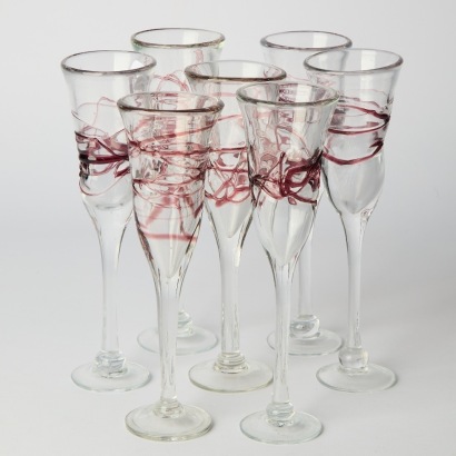 A Set of Seven Artisan Glass Champagne Glasses