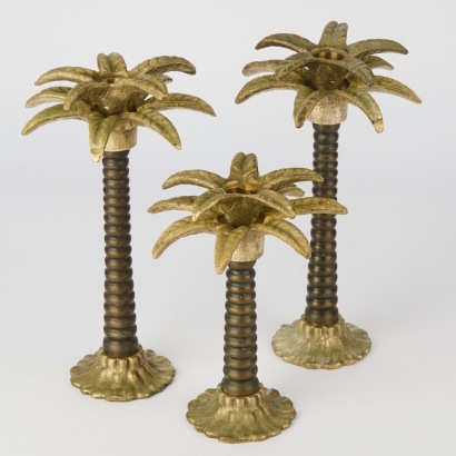 A Trio of Bronze Palm Tree Candlesticks