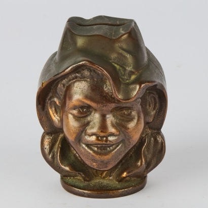 A Bronze A.C. Williams Two Faced Coin Bank
