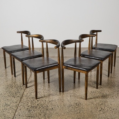 A Set of Six Elbow Dining Chairs