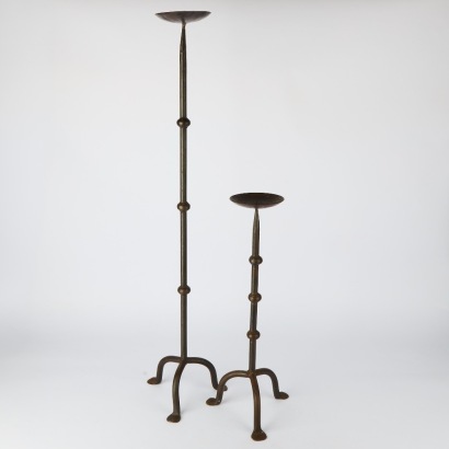 A Pair of Tall Cast Iron Candlestick Holders