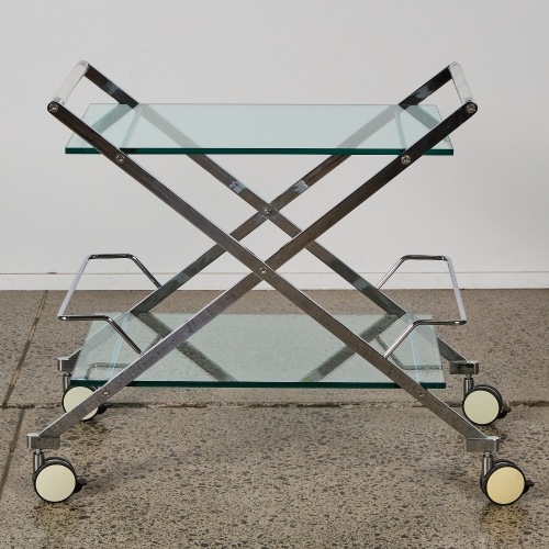A Hollywood Regency Style Polished Chrome and Glass Bar Cart with Lucite Handles