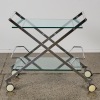 A Hollywood Regency Style Polished Chrome and Glass Bar Cart with Lucite Handles
