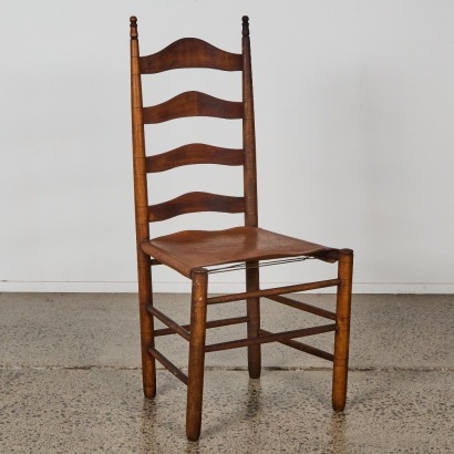 An Antique Ladderback Chair with Leather