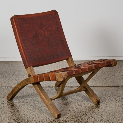 A Hardwood and Tooled Leather Butterfly Folding Chair by Angel Pazmino, Ecuador