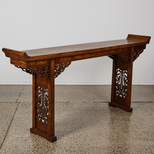 A Chinese 19th century Qing Dynasty carved hardwood two-drawer table