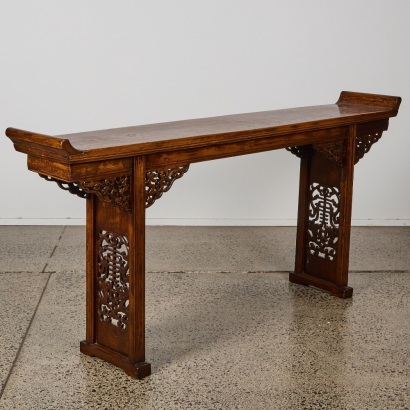 A Chinese 19th century Qing Dynasty carved hardwood two-drawer table