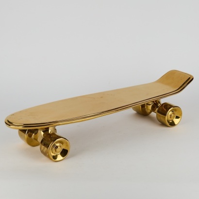 A Seletti Gold Ceramic Skateboard Tray
