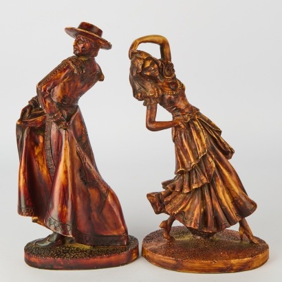 A Pair of Vintage Matador and Senorita Resin Statues