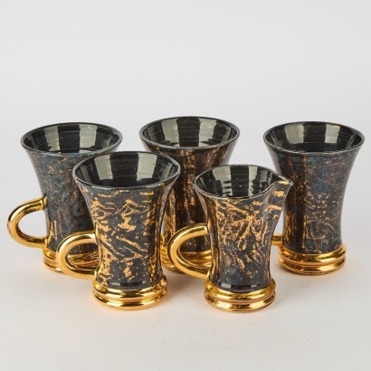 A Set of Four Cups & Milk Jug By Peter Collis