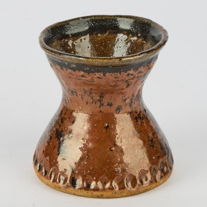 A Barry Brickell Fluted Vase with a Pinched Base Rim with Heavy Tenmoku Glaze