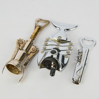 A collection of three Corkscrews. A Lazy fish. A Vintage Italian made winged Corkscrew and a Cognac Bisquit wine knife