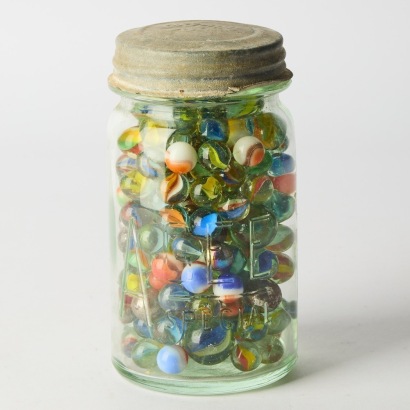 A Vintage Agee Jar filled with Marbles, Swirlies, Steelies and Bommers