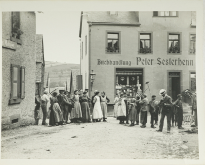 Women and Children Standing Outside the Bookshop