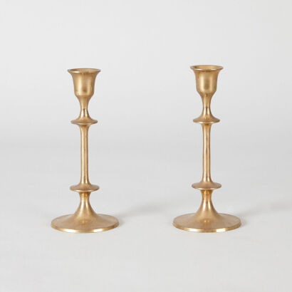 A Pair of Knotted and Faceted Brass Candlesticks