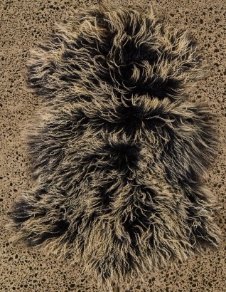 A Medium Tibetan Lamb Hide Rug (Dark and White)