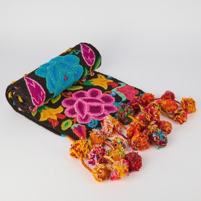A Handwoven Textile with Polka Fringe