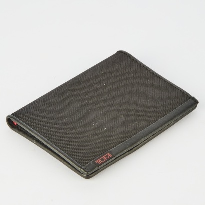 A Tumi Passport and Credit Card Wallet