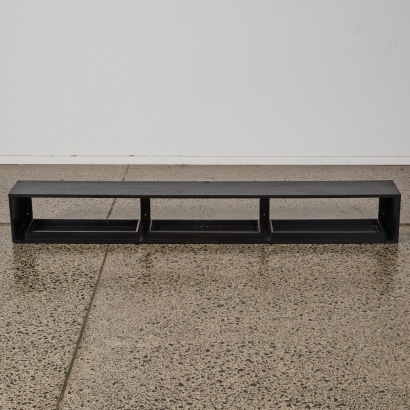 A Wall Mounted Black Shelving Unit