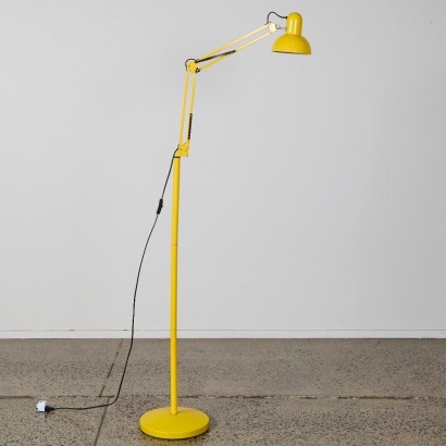 A Yellow Floorstanding Adjustable Lamp