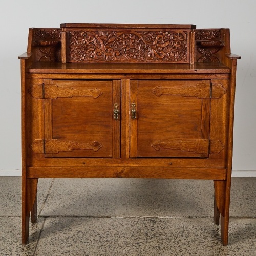 An Arts and Crafts Cabinet with Charming Hand-Carved Detail