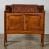 An Arts and Crafts Cabinet with Charming Hand-Carved Detail