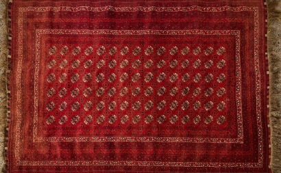 A Large Vintage All-Wool Afghan Bukhara Rug