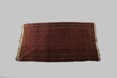 A Red Baluch Rug