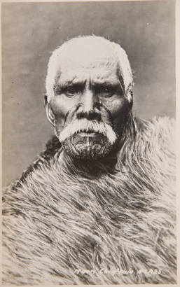 FREDERICK GEORGE RADCLIFFE RPPC postcard of an elderly Māori man with an extraordinary tā moku