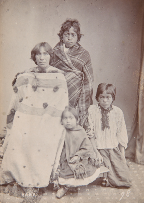 UNKNOWN PHOTOGRAPHER Group full-length portrait of four Māori, idenitified as Hara