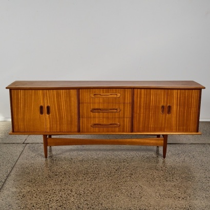 A Mid Century Sculptured Sideboard