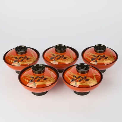 A Set of Five 20th Century Japanese Red and Black Lacquer Covered Gold-Decorated Bowls