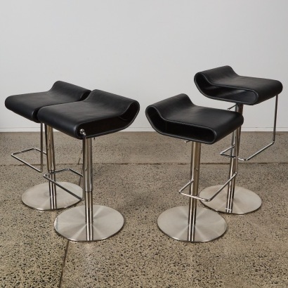 A Set of Four Limitless Leather Barstools