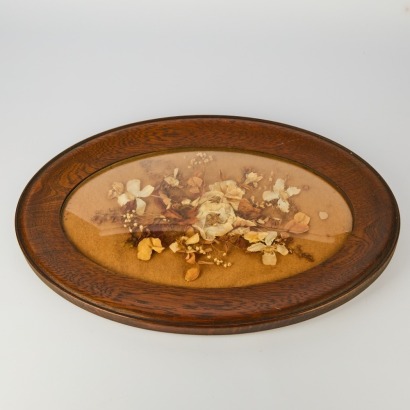An Antique Dried Flower Display in a Convex Oak Frame