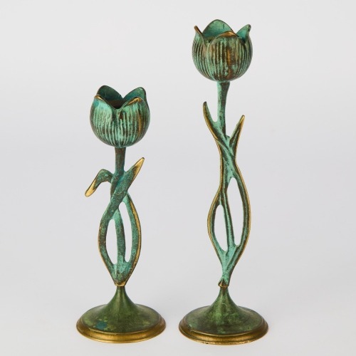 A Pair of Bronze Tulip Candlesticks