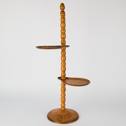 A Vintage Tiered Wooden Plant Stand with Cast Iron Base