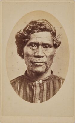 Three Carte de visite portraits, two buioldings and a portrait of a Māori boy wrapped in a cloak