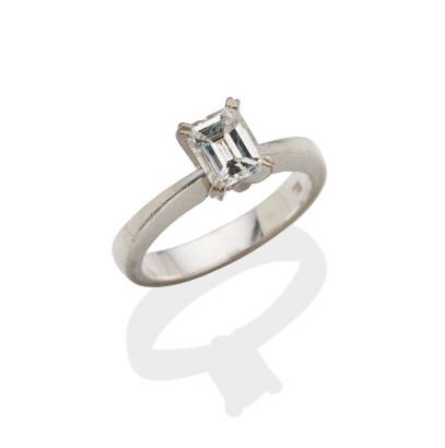 A 0.95 carat solitaire diamond ring, claw set emerald cut diamond of estimated weight, colour 'G' and clarity 'I1'. 18ct white gold. Weight 5.8 grams. Size L. Gemologist's report available.