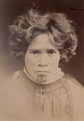 PULMAN'S PHOTOGRAPHIC STUDIO Portrait of wahine with moko kauae, wearing a kākahu