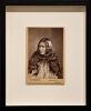 PULMAN'S PHOTOGRAPHIC STUDIO Portrait of a Māori wahine with a feather in her long hair and wearing a korowai - 2