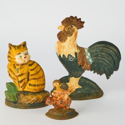 A Group of Three Antique Cast Iron Door Stops