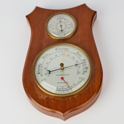 A Vintage Weathermaster Barometer Mounted on a Shield Plaque