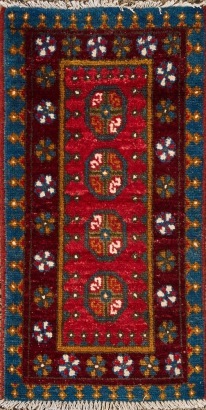 A Small Vintage Hand-Knotted Afghan Carpet