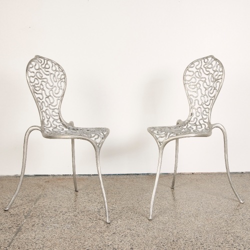 A Pair of Stephane Rondel Aluminum Peanut Chairs