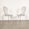 A Pair of Stephane Rondel Aluminum Peanut Chairs
