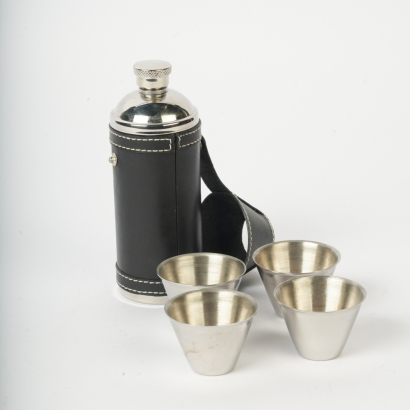 A Travel Flask with Four Shot Glasses