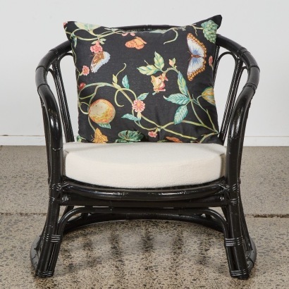A Black Cane Lounge Chair with Boucle Cushion